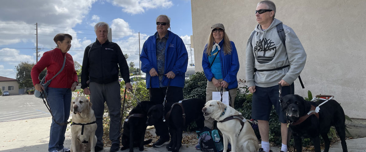 Members outside following Chapter meeting Doreen, Alan, Scott, Mindy and Paul with their guide dogs Paulette, Farlow, Moto and Jeremiah